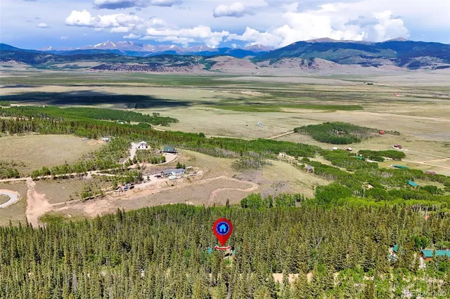 a view of mountains with lush green forest