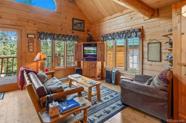 a living room with furniture a large window with outer view