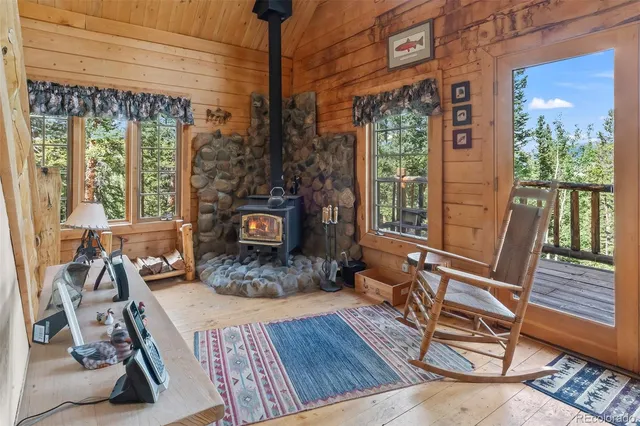 a living room with furniture windows and wooden floor