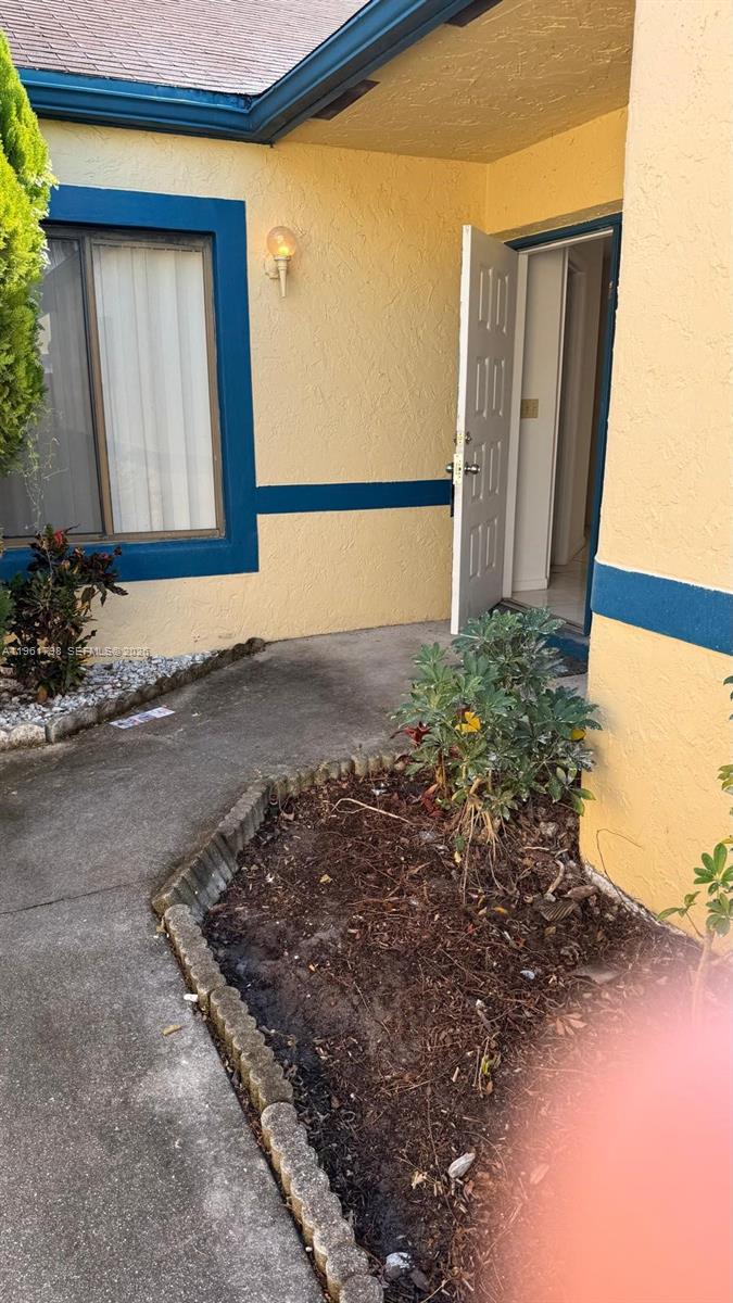 7450 Northwest 34th Street Lauderhill, FL 33351 - Photo 1 of 25 a view of a house with a yard