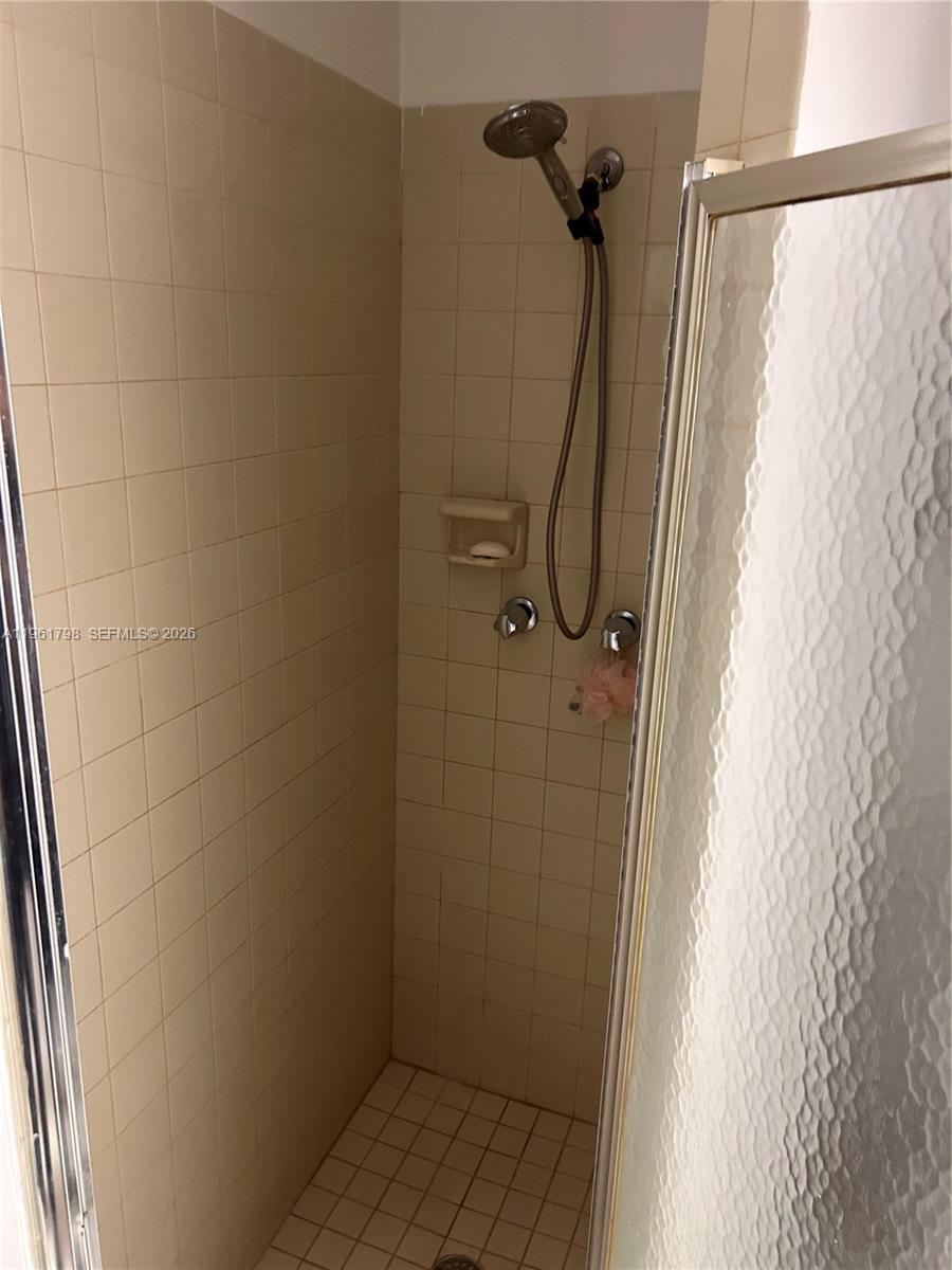 7450 Northwest 34th Street Lauderhill, FL 33351 - Photo 12 of 25 a bathroom with a shower