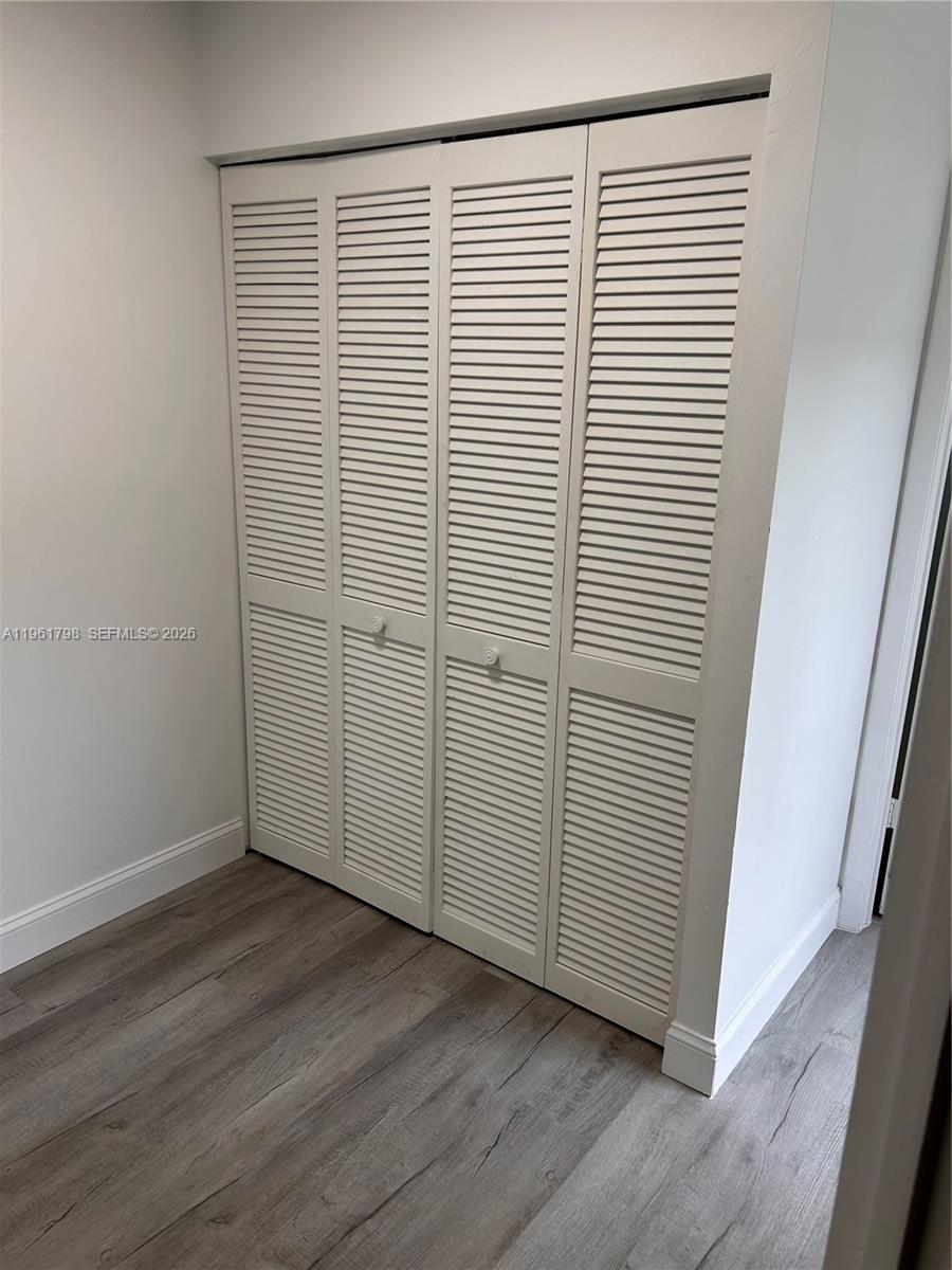 7450 Northwest 34th Street Lauderhill, FL 33351 - Photo 14 of 25 an empty room with wooden floor