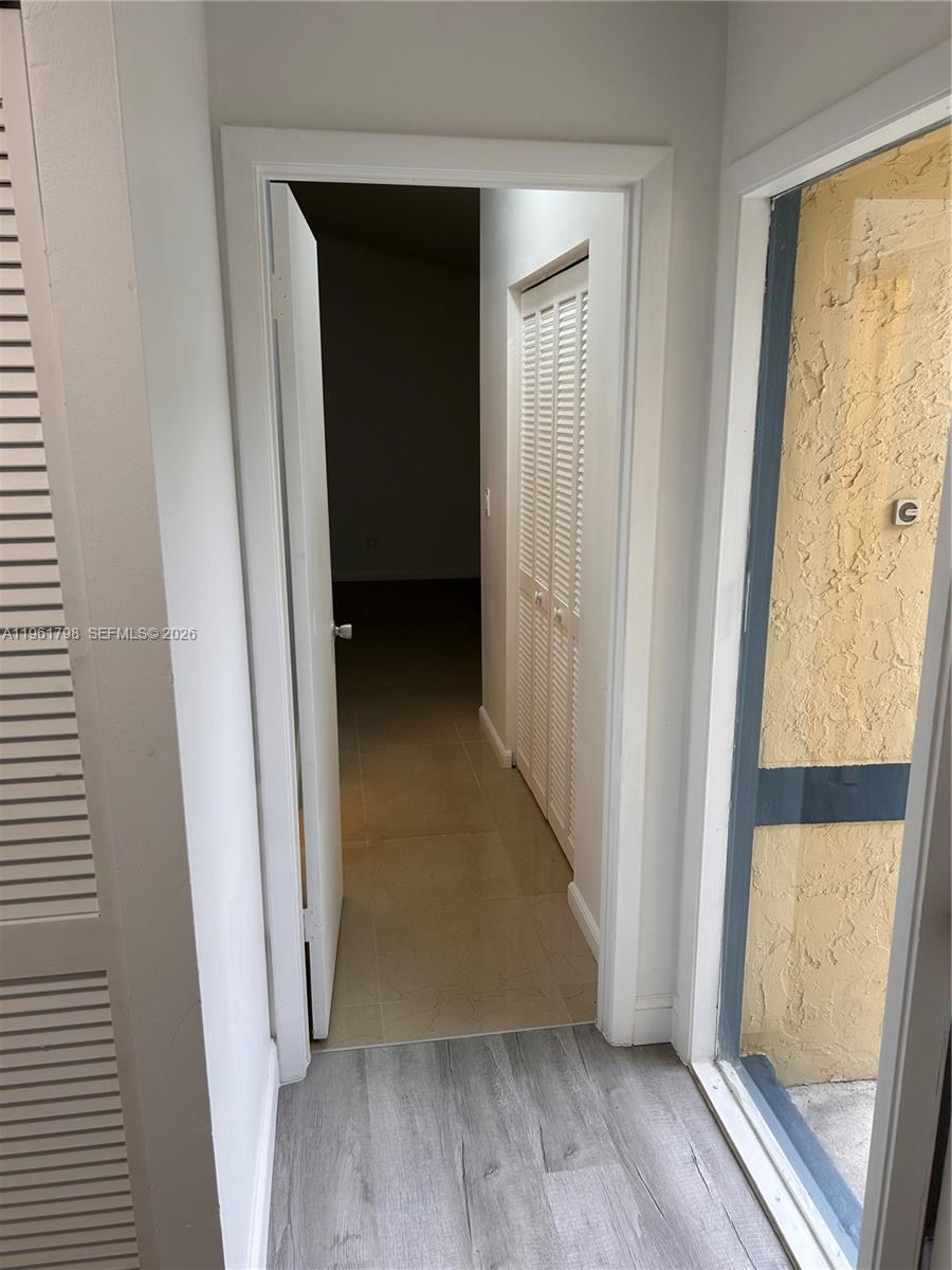 7450 Northwest 34th Street Lauderhill, FL 33351 - Photo 16 of 25 a view of a hallway with wooden floor and a window