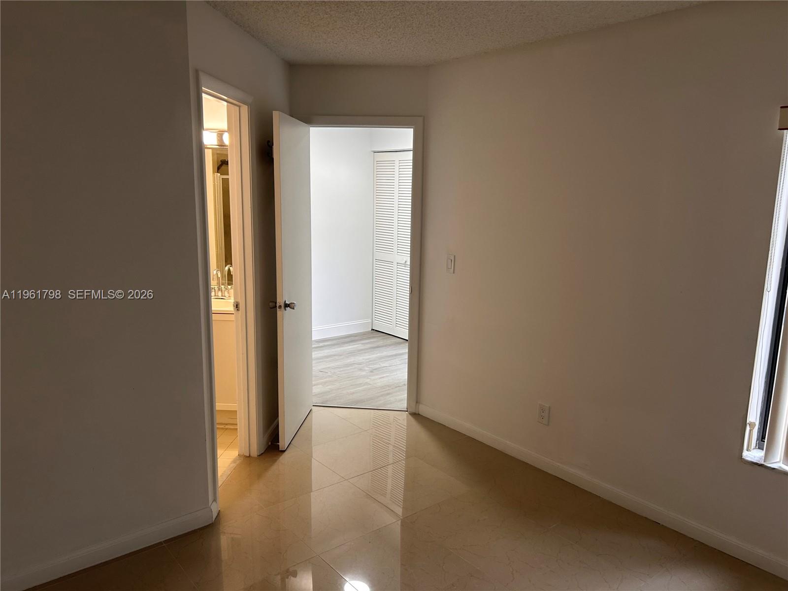 7450 Northwest 34th Street Lauderhill, FL 33351 - Photo 18 of 25 an empty room with windows