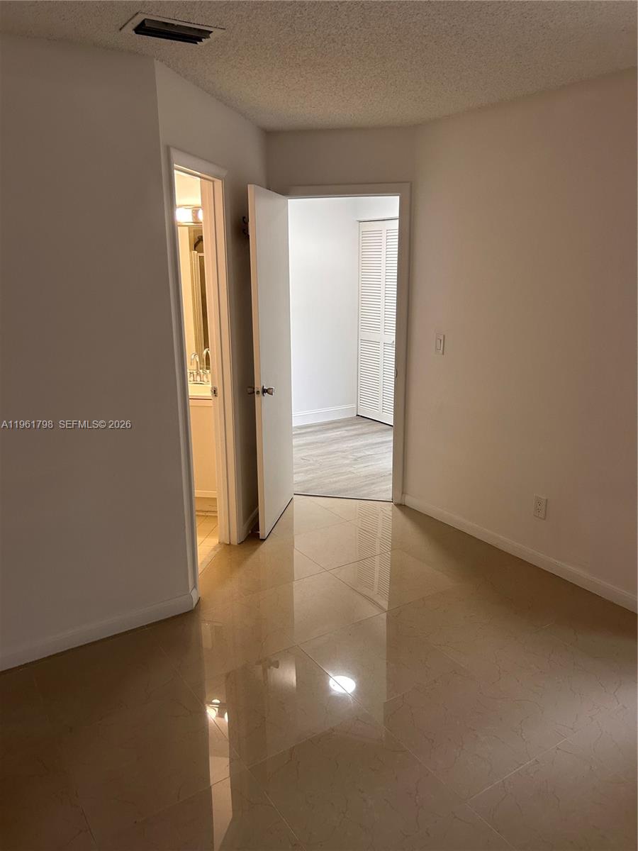 7450 Northwest 34th Street Lauderhill, FL 33351 - Photo 21 of 25 an empty room with windows