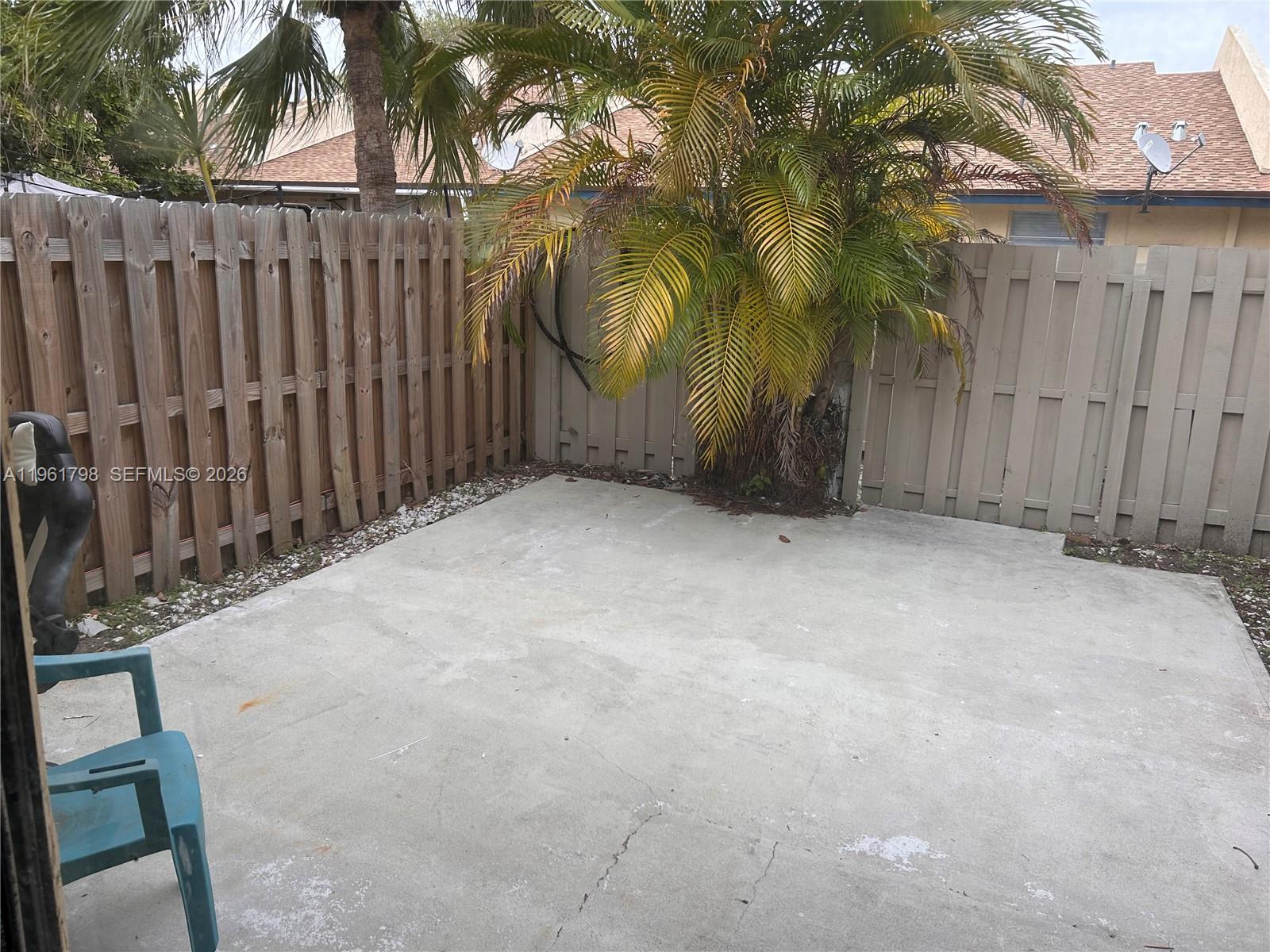 7450 Northwest 34th Street Lauderhill, FL 33351 - Photo 7 of 25 a view of a wooden fence