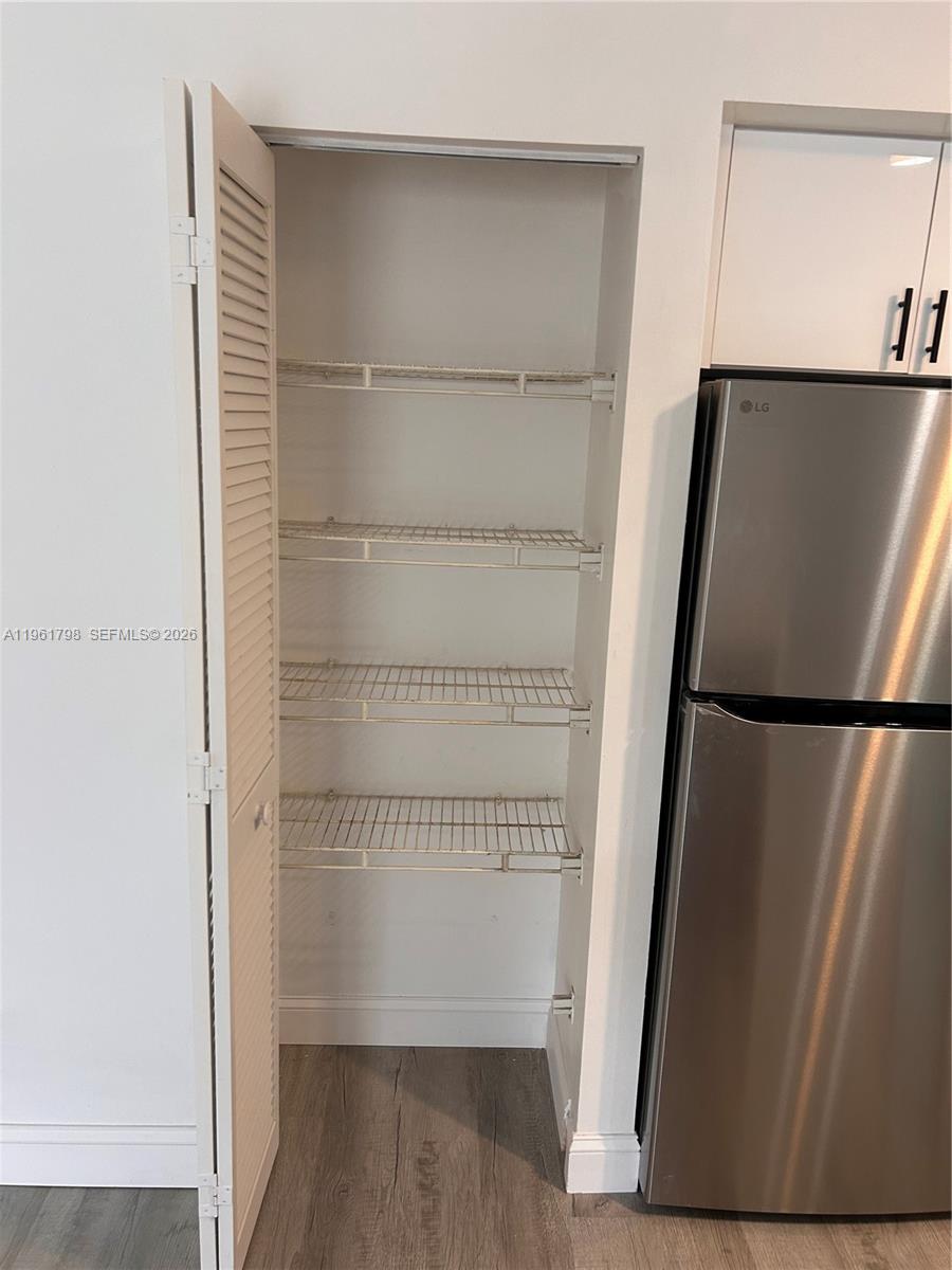 7450 Northwest 34th Street Lauderhill, FL 33351 - Photo 9 of 25 a view of walk in closet with empty racks