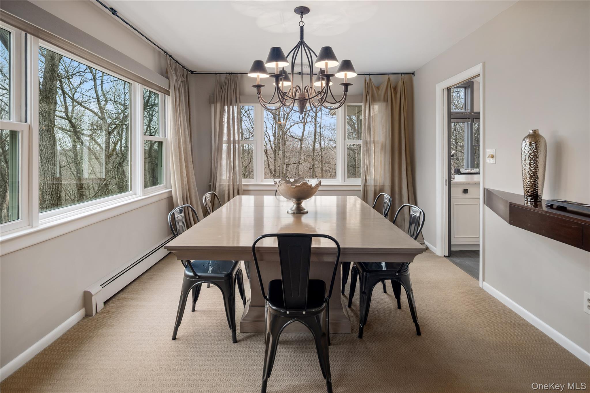 39 Mayberry Road Chappaqua, NY 10514 - Photo 14 of 44 a view of a dining room with furniture wooden floor and chandelier