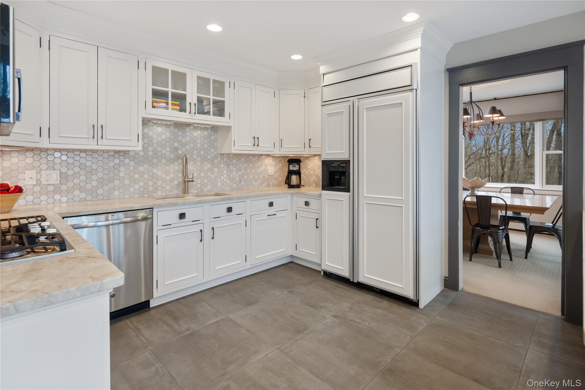 39 Mayberry Road Chappaqua, NY 10514 - Photo 17 of 44 a kitchen with white cabinets and sink