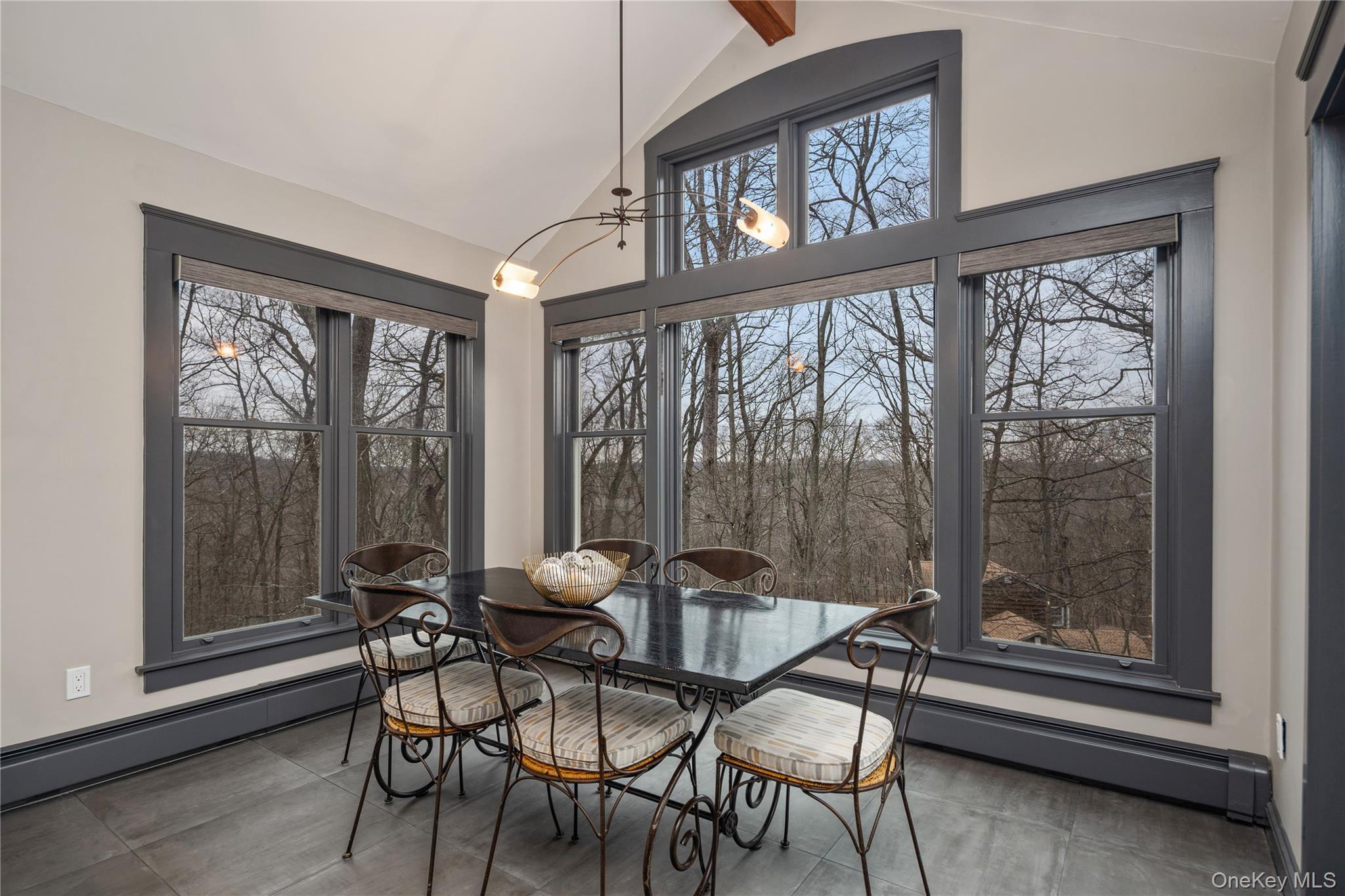 39 Mayberry Road Chappaqua, NY 10514 - Photo 21 of 44 a dining room with furniture and a large window