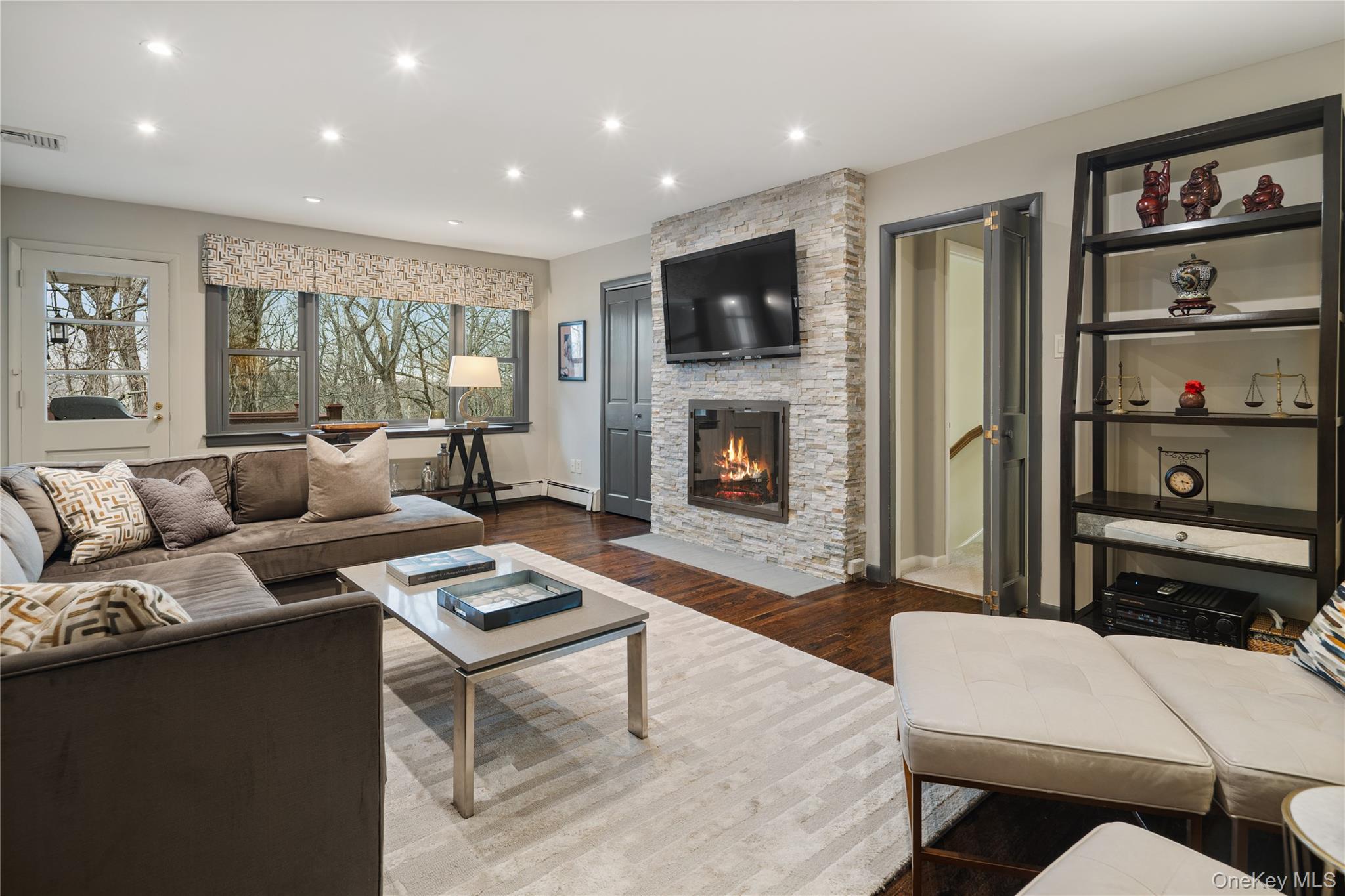 39 Mayberry Road Chappaqua, NY 10514 - Photo 24 of 44 a living room with furniture and a fireplace