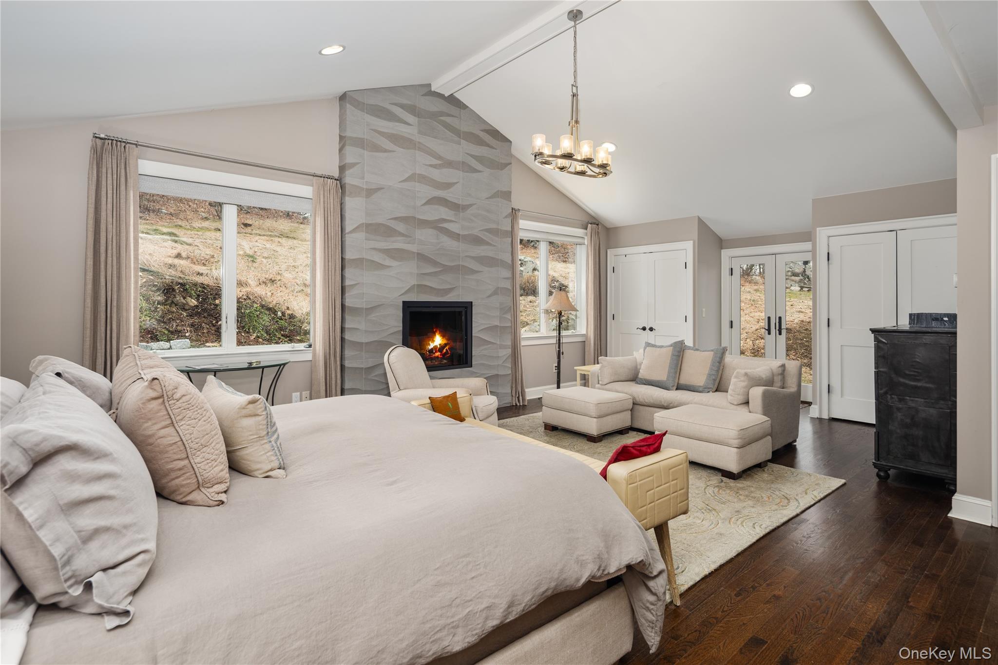 39 Mayberry Road Chappaqua, NY 10514 - Photo 25 of 44 a bedroom with a bed and a chandelier