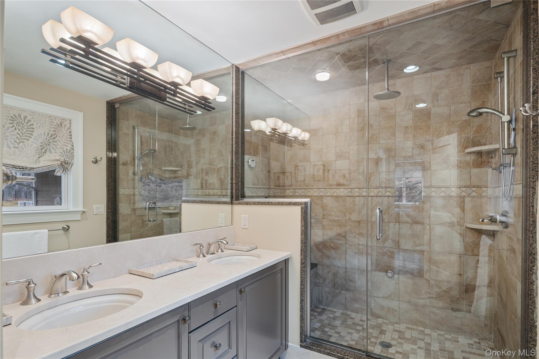 39 Mayberry Road Chappaqua, NY 10514 - Photo 29 of 44 a bathroom with a sink shower and a mirror