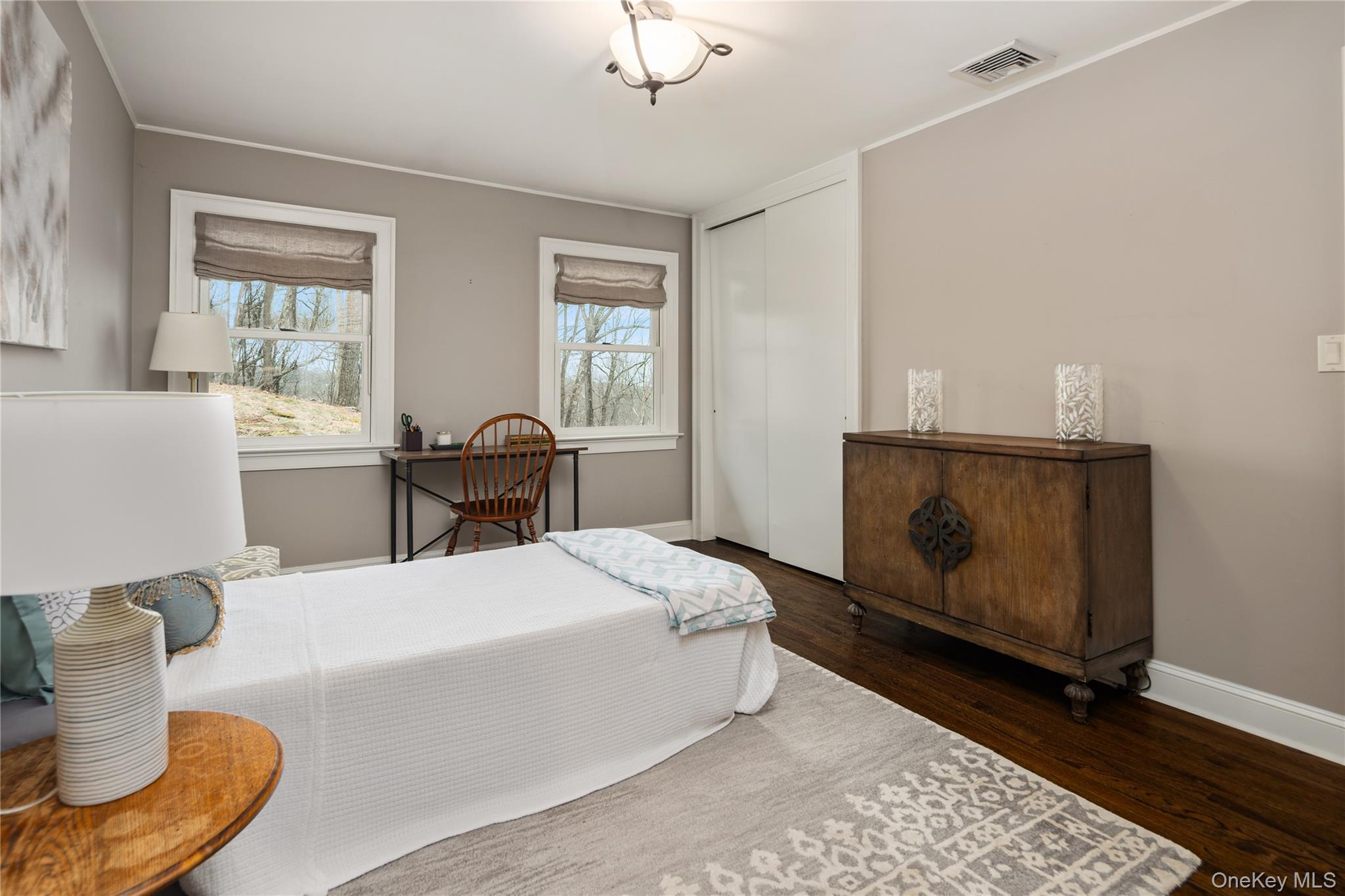 39 Mayberry Road Chappaqua, NY 10514 - Photo 30 of 44 a bedroom with a bed and wooden floor
