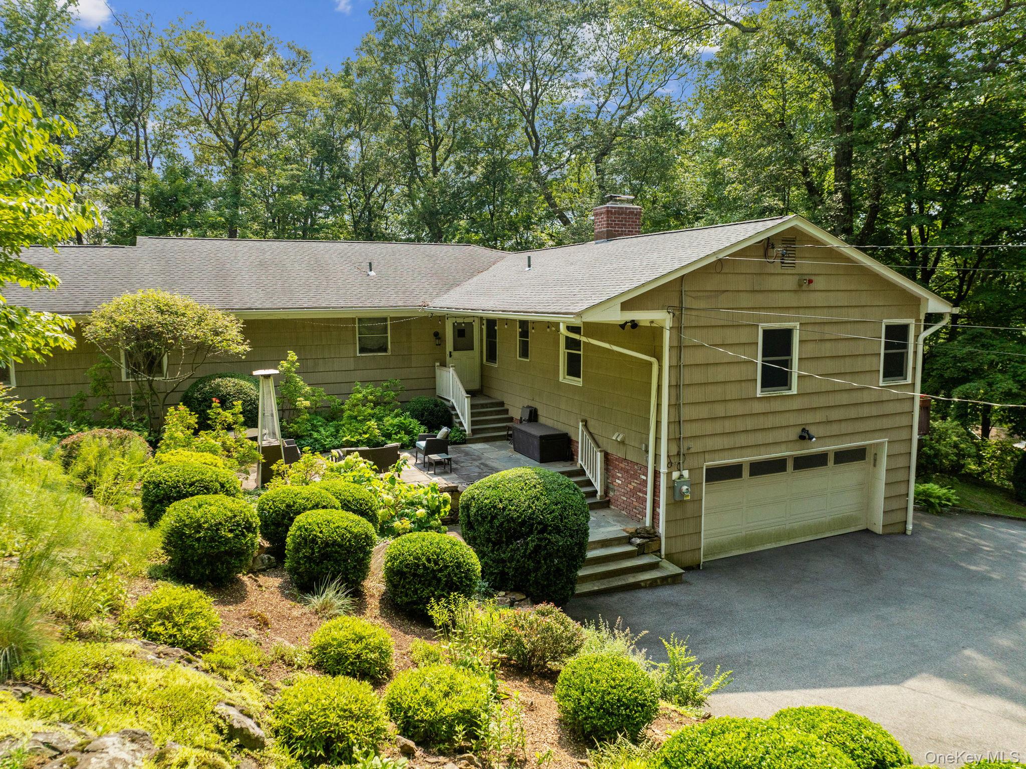 39 Mayberry Road Chappaqua, NY 10514 - Photo 3 of 44 a view of a house with a yard and garden