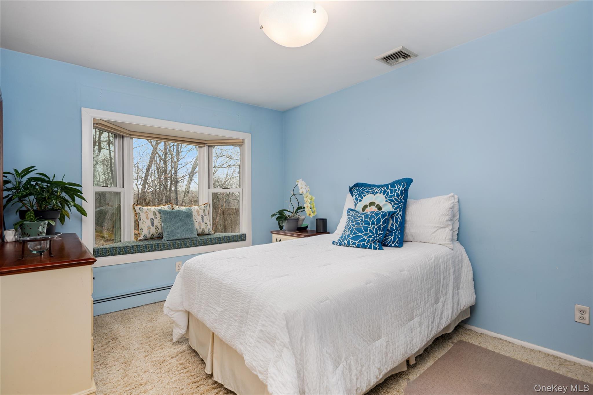 39 Mayberry Road Chappaqua, NY 10514 - Photo 31 of 44 a bedroom with a large bed and a large window