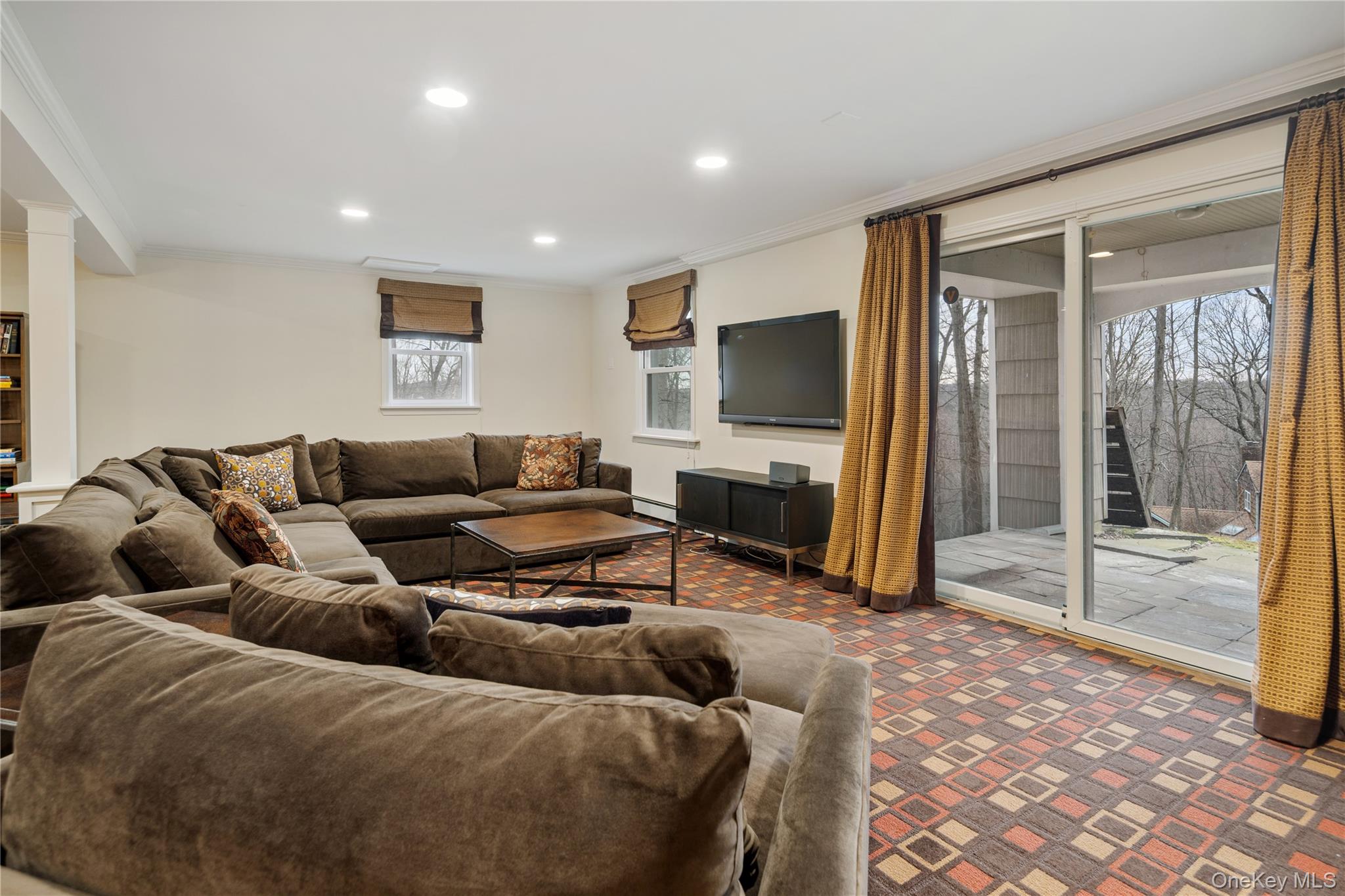 39 Mayberry Road Chappaqua, NY 10514 - Photo 39 of 44 a living room with furniture and a flat screen tv