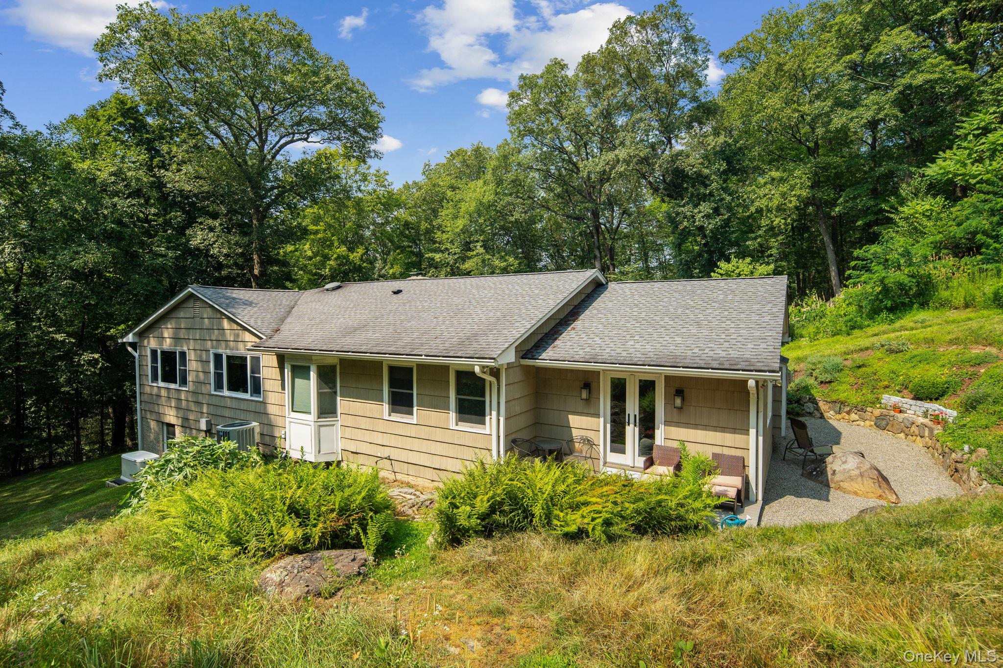 39 Mayberry Road Chappaqua, NY 10514 - Photo 4 of 44 a front view of a house with garden