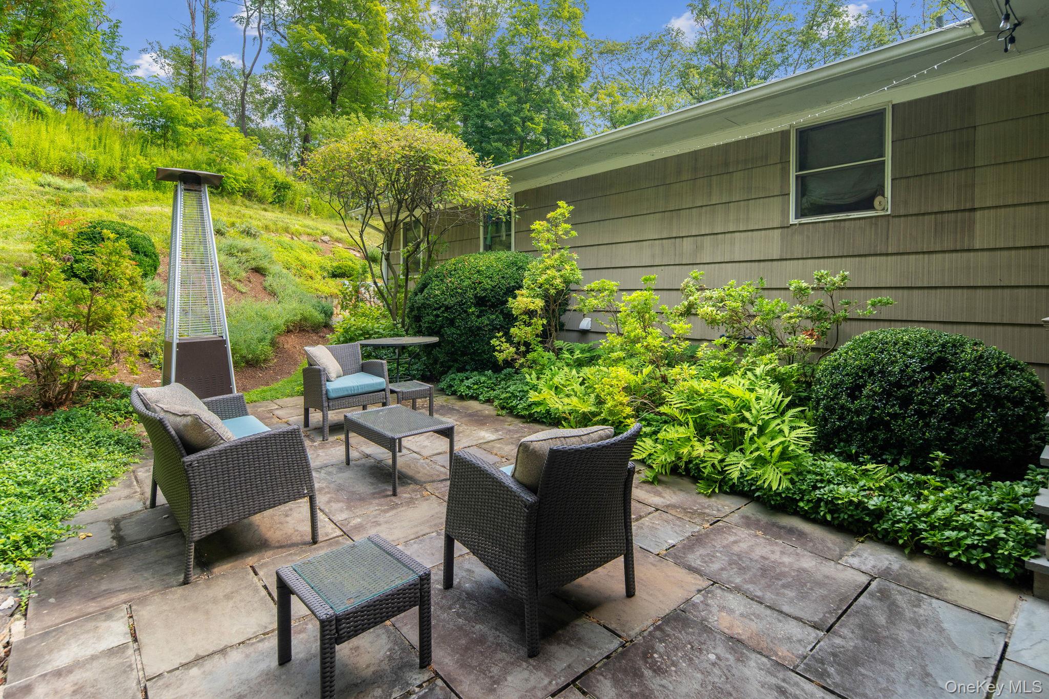 39 Mayberry Road Chappaqua, NY 10514 - Photo 5 of 44 a garden view with a seating space
