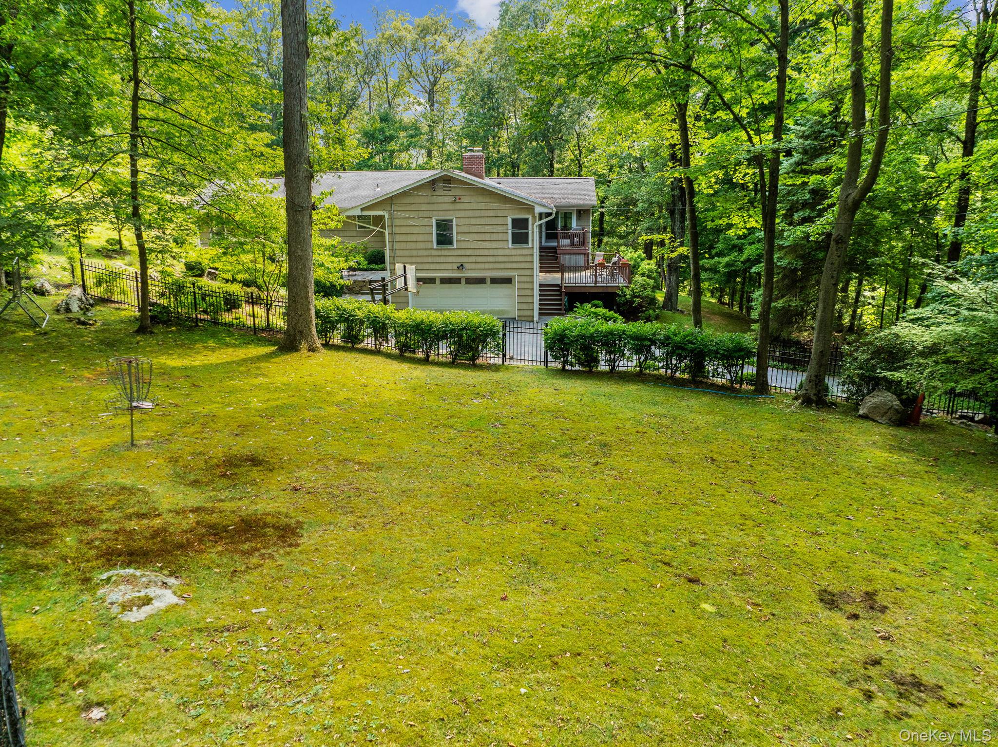 39 Mayberry Road Chappaqua, NY 10514 - Photo 7 of 44 a view of a house with a yard and sitting area