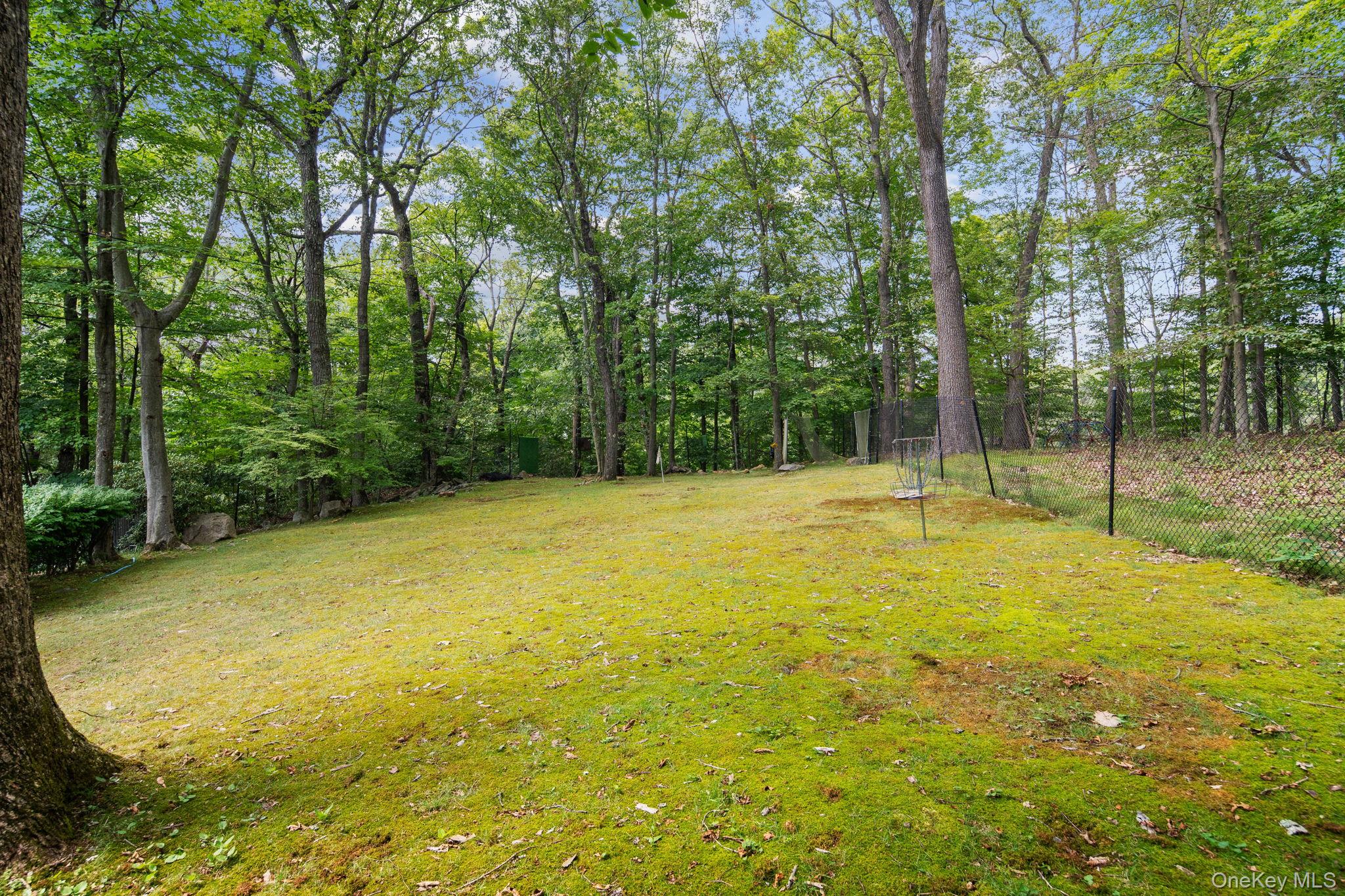 39 Mayberry Road Chappaqua, NY 10514 - Photo 8 of 44 a view of a swimming pool with an outdoor space and seating area