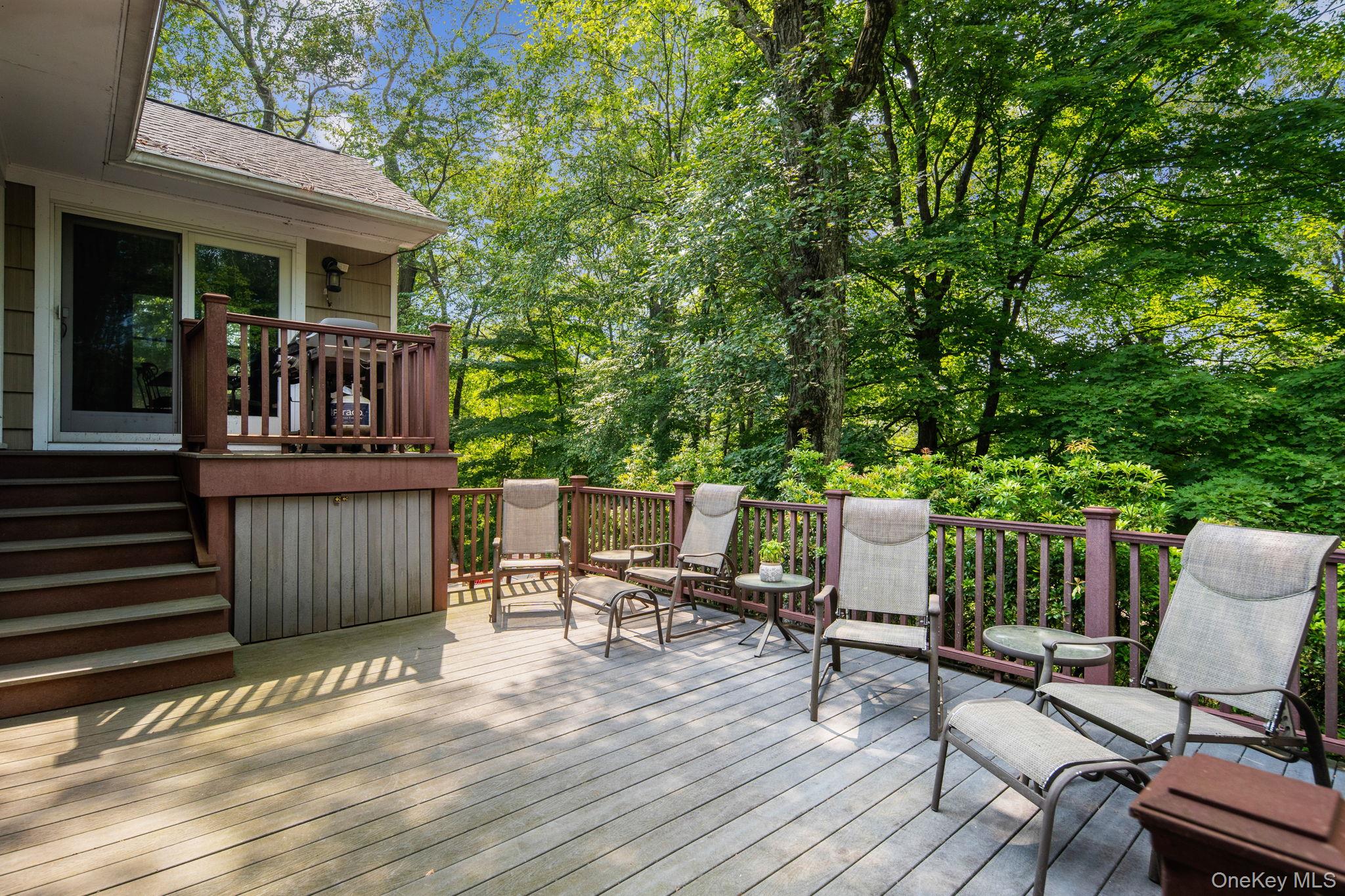 39 Mayberry Road Chappaqua, NY 10514 - Photo 10 of 44 a view of a house with wooden deck and furniture