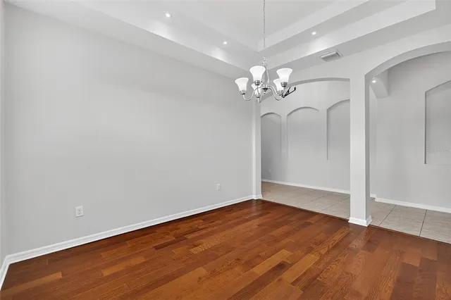 a kitchen with a sink refrigerator and cabinets