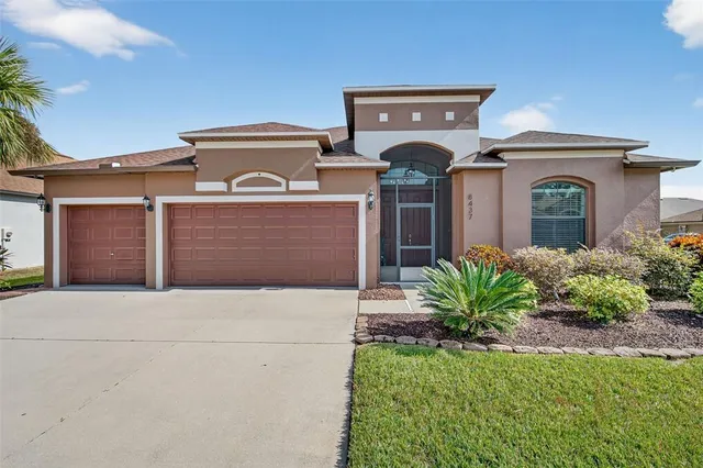 a view of a livingroom with wooden floor and white doors