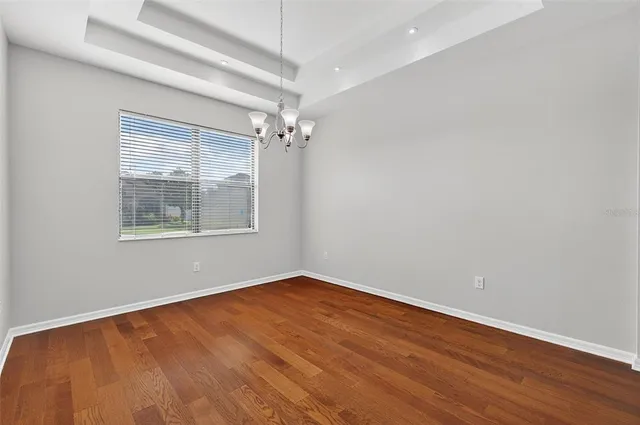 a view of a livingroom with kitchen and furniture