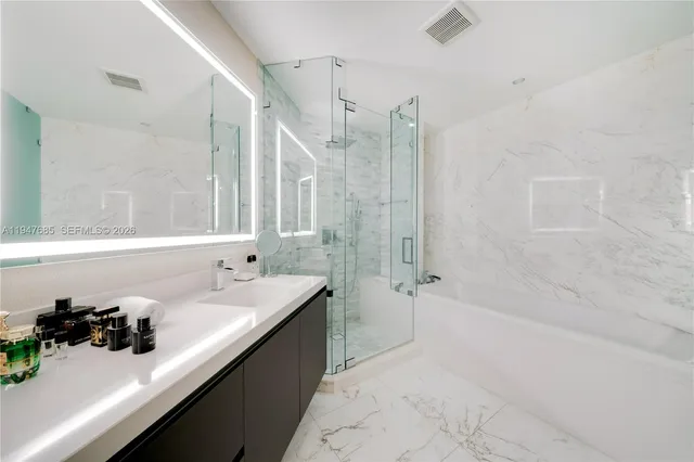 a bathroom with a sink double vanity and a bathtub