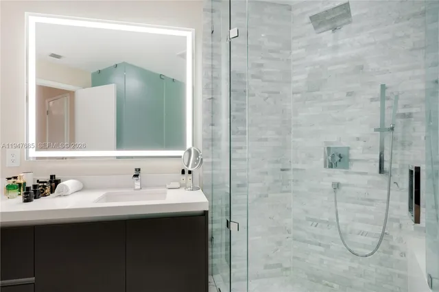 a bathroom with a sink and a mirror