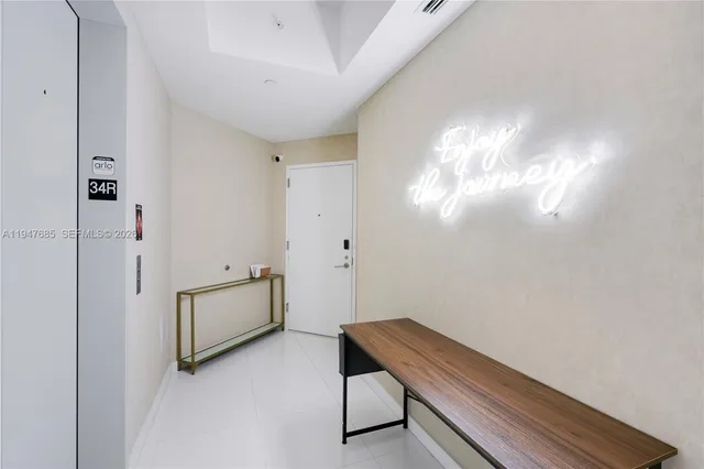 a view of a very nice looking dining room with a table and chairs
