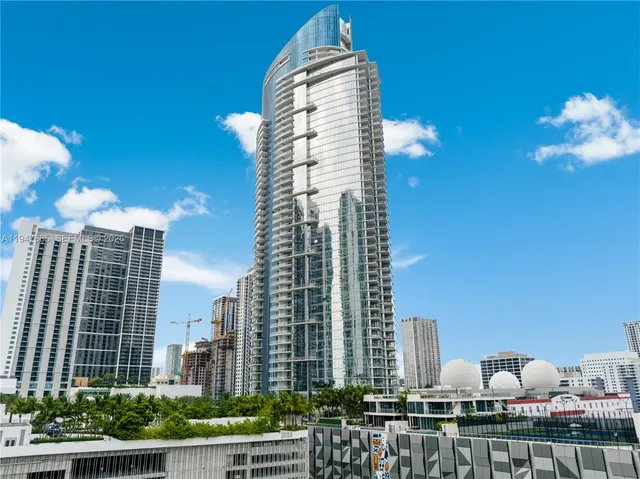 a view of a room with furniture and wooden floor