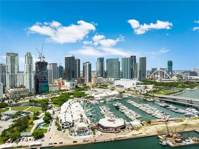 a small pool table and chairs are sitting on the wooden floor