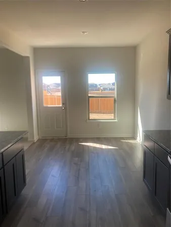 a white toilet sitting next to a sink
