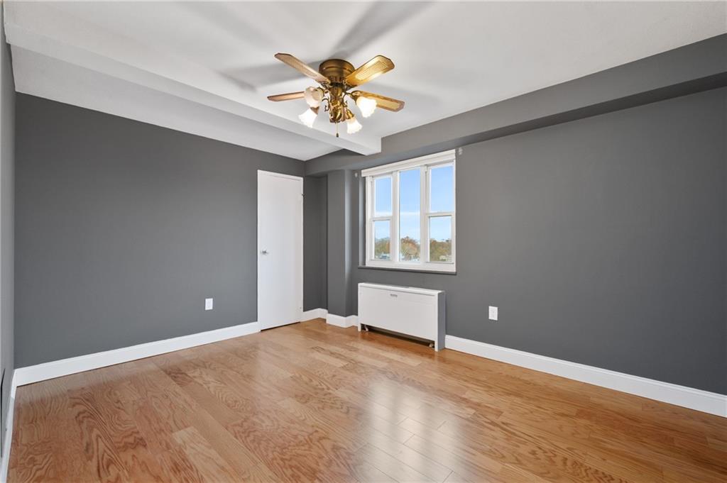 4625 Fifth Avenue, Unit 607 Pittsburgh, PA 15213 - Photo 12 of 22 wooden floor in an empty room with a window