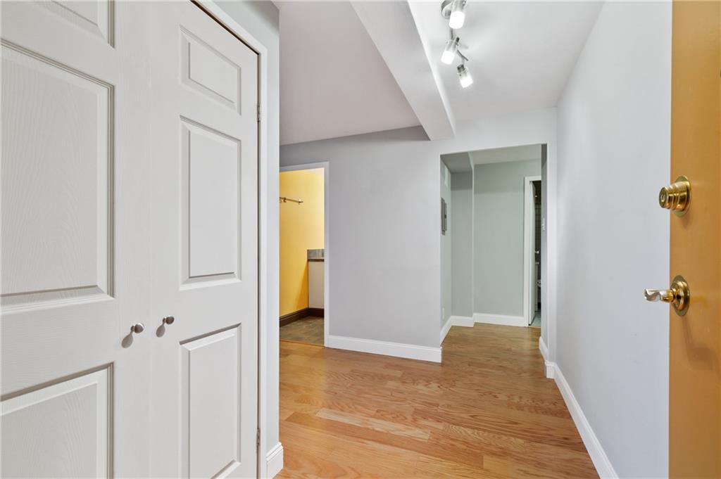 4625 Fifth Avenue, Unit 607 Pittsburgh, PA 15213 - Photo 17 of 22 a view of a hallway with wooden floor and staircase