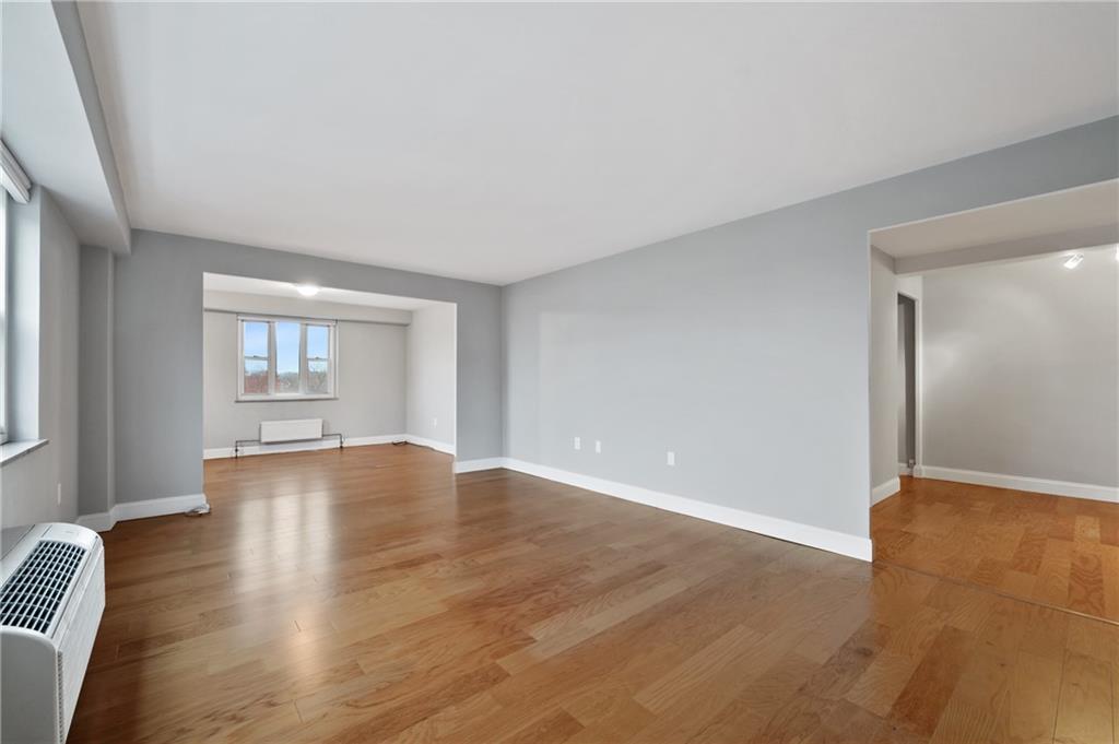 4625 Fifth Avenue, Unit 607 Pittsburgh, PA 15213 - Photo 3 of 22 an empty room with wooden floor and windows