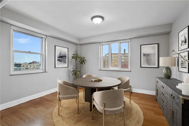 a dining room with furniture and window