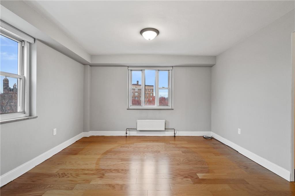 4625 Fifth Avenue, Unit 607 Pittsburgh, PA 15213 - Photo 5 of 22 a view of a room with wooden floor and window