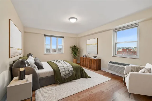 a bedroom with two beds and a couch