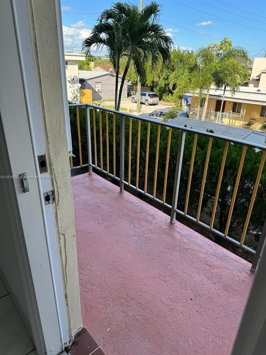 1747 Rodman Street, Unit 203 Hollywood, FL 33020 - Photo 11 of 16 a view of balcony with furniture