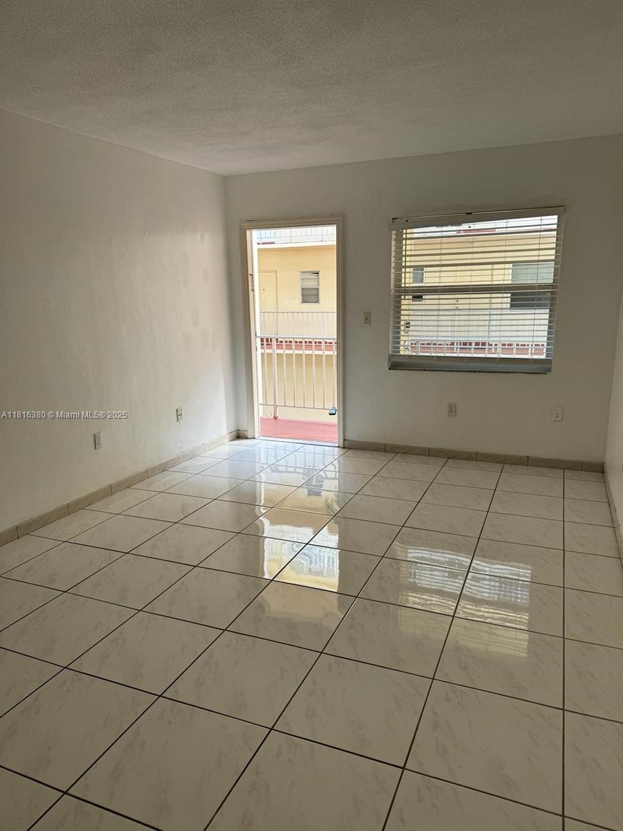 1747 Rodman Street, Unit 203 Hollywood, FL 33020 - Photo 2 of 16 a view of an empty room and window