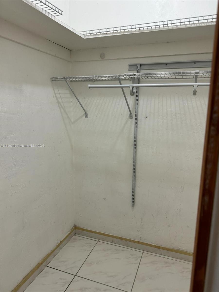 1747 Rodman Street, Unit 203 Hollywood, FL 33020 - Photo 6 of 16 a view of a room with racks on the wall