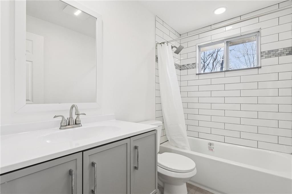 826 Blue Ridge Road Pittsburgh, PA 15239 - Photo 22 of 26 a bathroom with a sink a toilet and shower