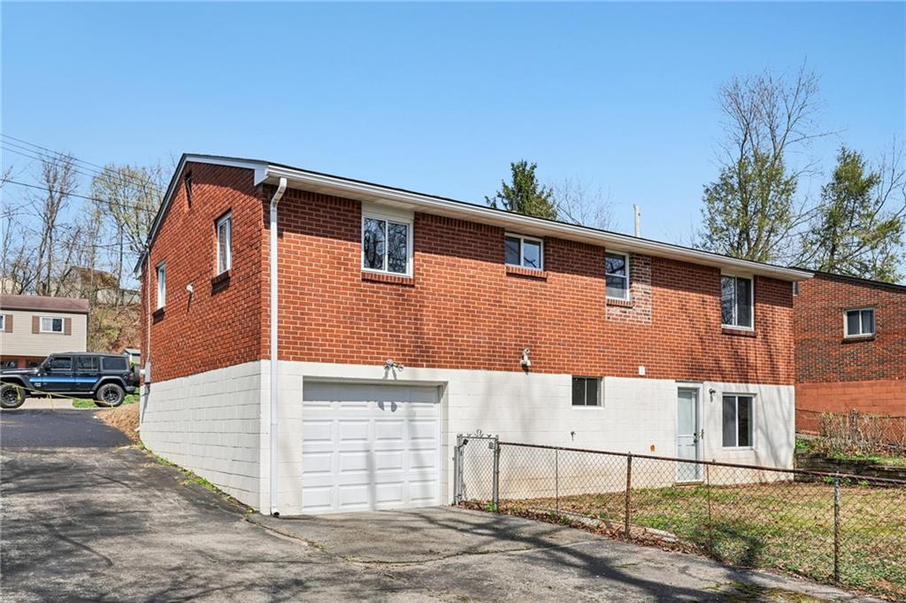 826 Blue Ridge Road Pittsburgh, PA 15239 - Photo 24 of 26 a view of a house with a street