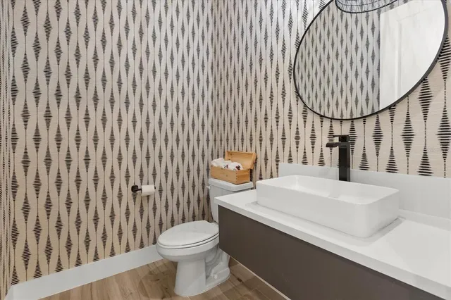 a view of a livingroom with furniture and wooden floor