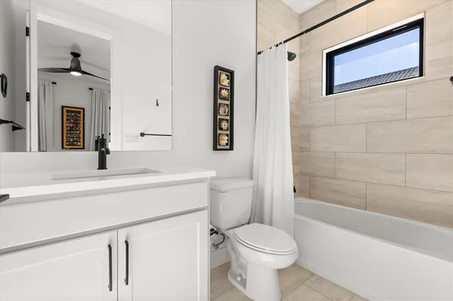 a bedroom with a large bed and a large window