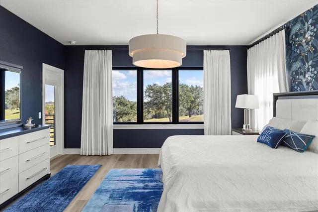 a bedroom with a bed and a painting