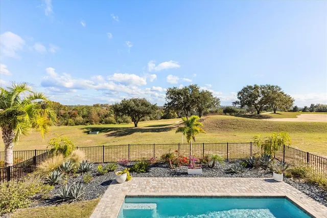 an aerial view of a house with a ocean view
